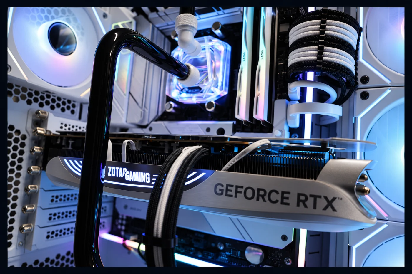 Close-up of graphics hardware, hardline tubing and sleeved cabling in a custom build